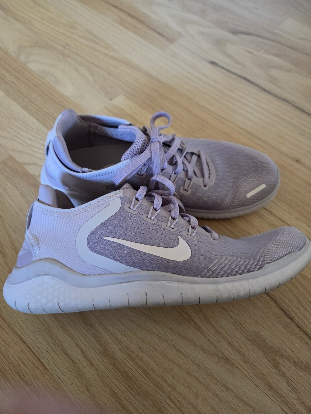 Nike Women's Pink Lilac Athletic Running Sneakers with White Swoosh